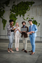 Fototapeta premium Diverse business team collaborating on global sustainability strategy