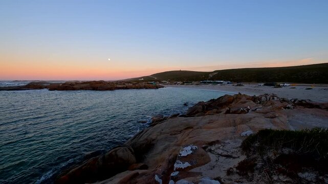 Scenic morning moonset view over Tieties Bay campsite on Cape West Coast, RSA