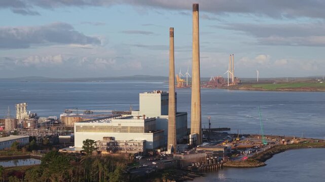 Tarbert Power Station by the sea in County Kerry, calm industrial scene