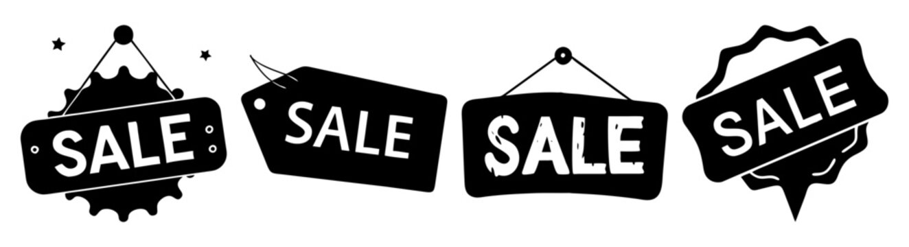 Sale tags hanging on rope with black background for retail discount promotion and clearance advertising
