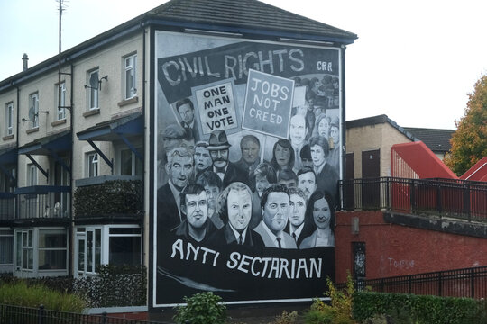 October 8th 2025. Derry, County Londonderry, Northern Ireland. Civil Rights and Anti-Sectarian Mural in Derry, Northern Ireland, Featuring Historical Figures and Protest Signs