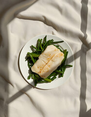 Fish and greens healthy lunch flat lay