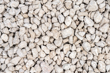 Naklejka premium Close-up of gray gravel stones for construction. Gravel stones near railroad tracks and roads. Background. Texture.