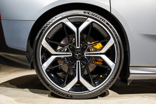 Zurich Auto Show, Switzerland, October 31, 2025. Large22 inch alloy wheel with 295 30 R22 size tire on the new Polestar 5 battery electric sedan displayed at the Zurich Auto Show