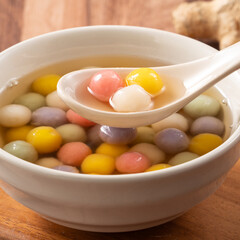 Colorful sweet glutinous rice balls tangyuan in sweet ginger syrup soup