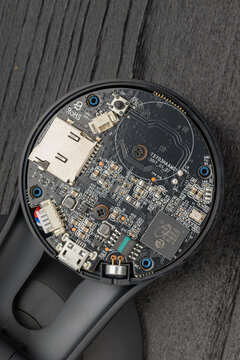 The interior circuit board of a spherical webcam with components visible.