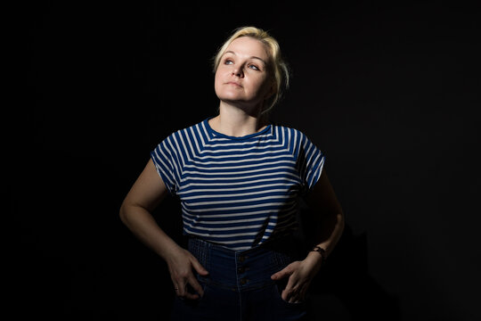 women from the darkness arrogantly looks to the side