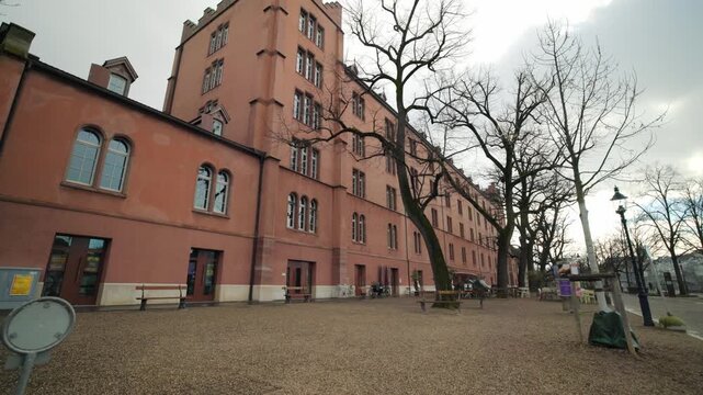 Historical red brick architecture of the Kaserne cultural center in Basel with pan, Switzerland.