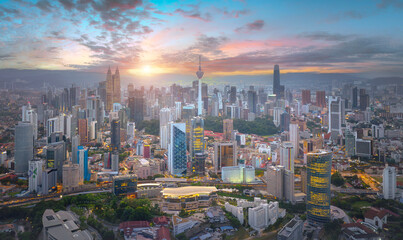 Fototapeta premium An aerial view of the Kuala Lumpur city Malaysia, Modern buildings and street traffic.Kuala Lumpur city skyline with dramatic sky , twilight scene . Malaysia . 