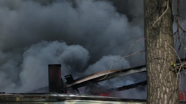 Aerial view Man athlete trains cross-country skiing in winter on snow covered track in forest.