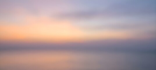 Obraz premium Minimalist Soft Pastel Gradient Background with Blurred Sunset Colors and Dreamy Bokeh