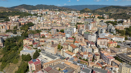 Fototapeta premium Aerial view of the historic center of Catanzaro, Italy. This city is the capital of the Calabria region. The houses and buildings of the old town are perched on the hills. Sunny summer morning.