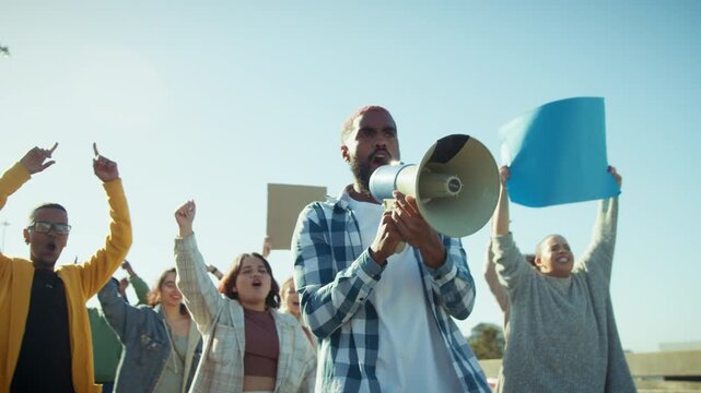 Man with megaphone leading protest