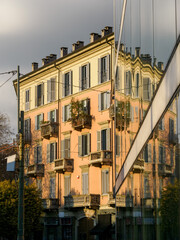 Facade of old residential building along via Pasubio in Milan, Italy