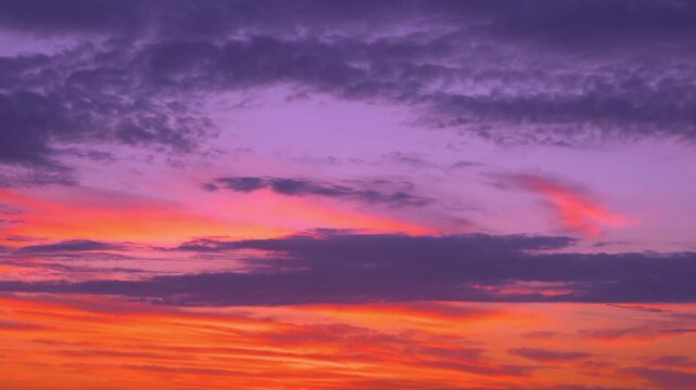Colored Sunset Sky Sun Light Clouds Air Plane Window View, Aerial Drone View, Time Lapse. Colorful Cloudy Sky in Sun Rays, Orange Lilac Sky Atmosphere 4K Background.