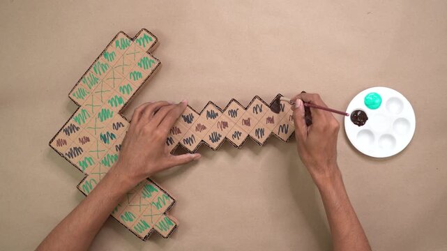 Hand painting cardboard box crafts, overhead pickaxe crafts