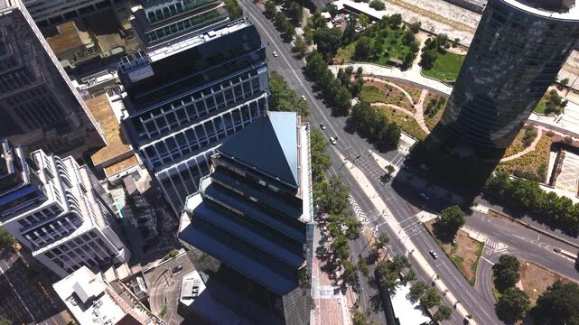 High-angle aerial drone view of the Postmodern World Trade Center Santiago and corporate towers in the El Golf financial district of Las Condes, Chile, 4K.