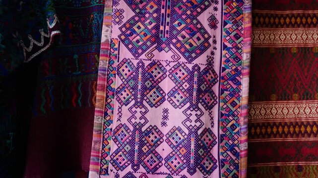 Colorful traditional Guatemalan textiles displayed with woven patterns
