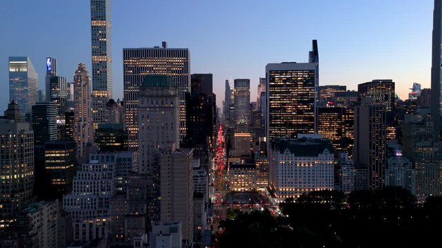 Drone shot of Manhattan's Skyline and 5th Ave at twilight.
