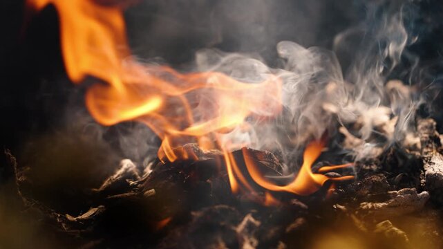 Flames and smoke rise from sacred Mayan fire during ceremony