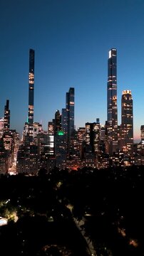 Vertical drone shot of the Manhattan Skyline at sunset.