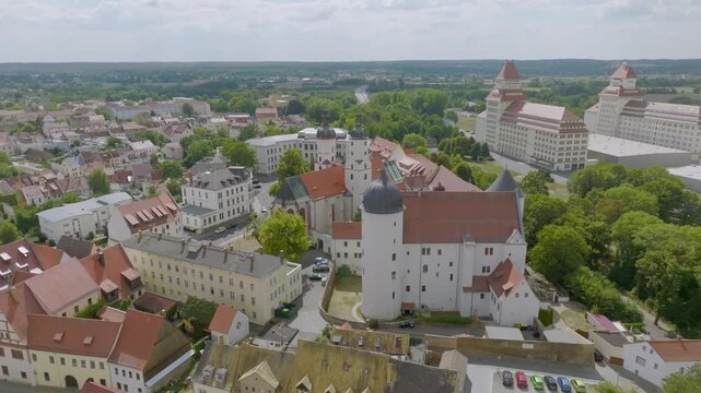 Top view of the historic building ensemble in Borna. The focus is on the prominent St. Mary's City Church with its characteristic towers and the immediately adjacent Museum of the City of Borna, house