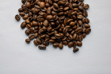 roasted coffee beans on white background