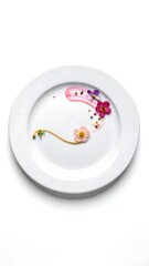 A white plate with a floral design on a plain white background