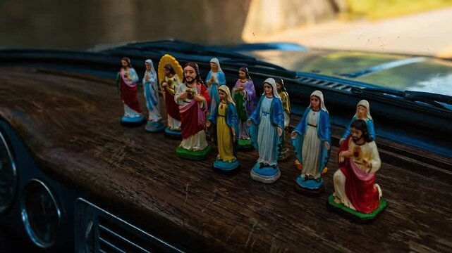 Plastic Jesus Mary Statues - Colorful Wooden Surface Dashboard Sunlight Shadows Pop-Art Vibrant