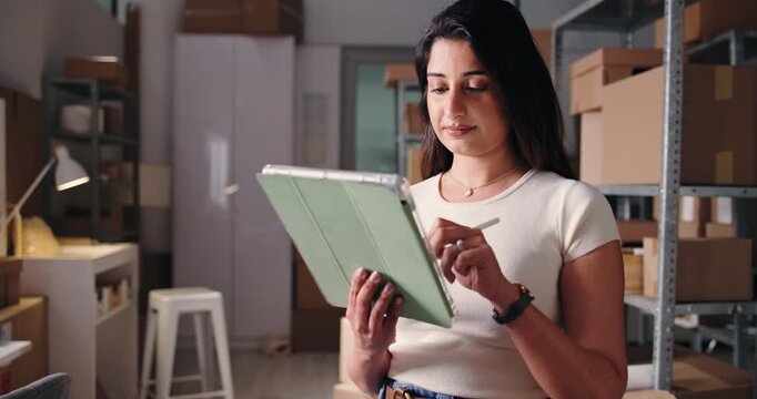 Ecommerce, checklist or seller in office with tablet, inventory or export management in supply chain. Logistics, stylus or Indian woman in agency with tech, package or cargo control in distribution.