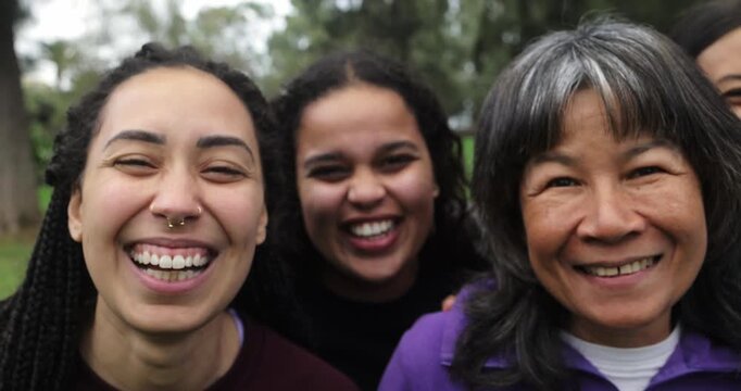 Happy multi generational women having fun together at city park - Multiracial friends laughing on camera after yoga class outdoor - Sport and women day concept