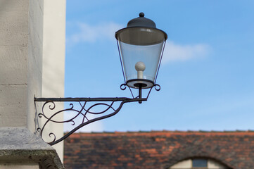 Vintage wall lantern with wrought-iron bracket