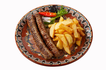 Kebabs with fries and salad