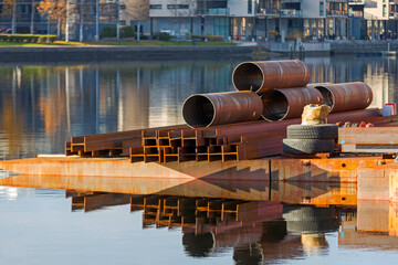 Steel Beams and Large Pipes at Barge Construction Site in Norway