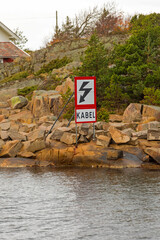 Underwater Cable Warning Sign Kabel Danger at Sea Coast in Sweden