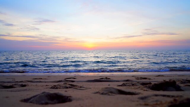 Waves at sea beach on dramatic sunset. Sea waves at beach coast. Waves on sea in calm weather. Splashing Waves in ocean. Ocean wave at sandy shore. Seaside sand beach in tropical island.