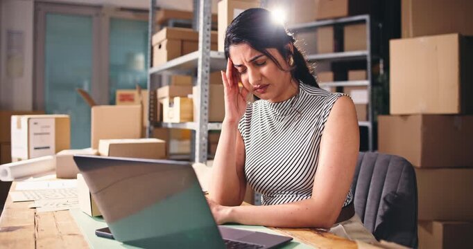 Frustrated, woman or ecommerce in office with laptop with distribution backlog, mistake or headache. Computer, tired person and migraine with courier delay, supplier problem and logistics difficulty.