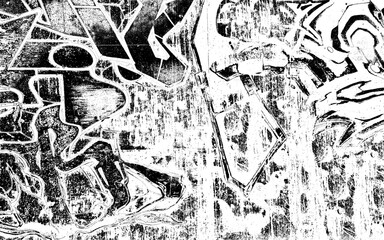Fototapeta premium A black and white photo of graffiti on a wall. The graffiti is in various shapes and sizes, and the overall mood of the image is chaotic and urban