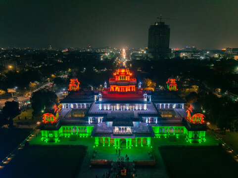 Aerial view of the majestic Albert Hall Museum illuminated in vibrant tricolor lights against the dark sky, a beacon of culture and history, Jaipur, Rajasthan, India.