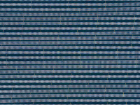 Aerial view of the dark linear patterns create a mesmerizing industrial tapestry, contrasting starkly with the geometric precision of the landscape, Wittelsheim, Grand Est, France.