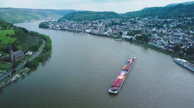 forward push of aerial view of Boppard in the Rhine Valley, with boats on the river passing by