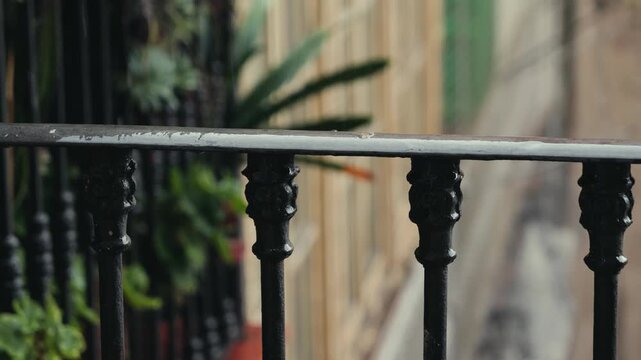 Raindrops on the balconies of houses, Rain flows down from the balconies on the ground.