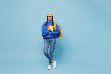 Young smart woman student she wear casual clothes yellow backpack bag hold books isolated on pastel...