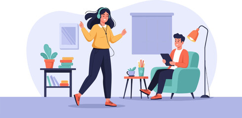 A woman with headphones dances while a man sits in an armchair and uses a tablet