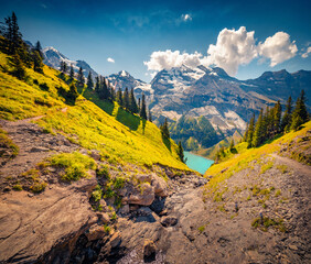 Obraz premium Aerial summer view of Oeschinensee Lake. Bright afternoon landscape of Bluemlisalp peak, Kandersteg village location, Switzerland, Europe. Majestic outdoor scene of Swiss Alps. 