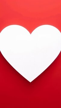 Vertical video: Starting white heart growing to fill red gradient frame with soft drop shadow