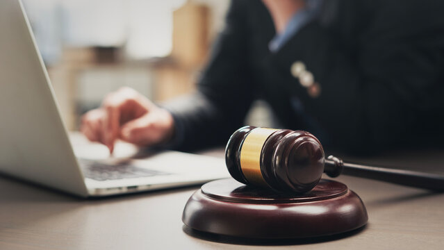 Lawyer using laptop in office