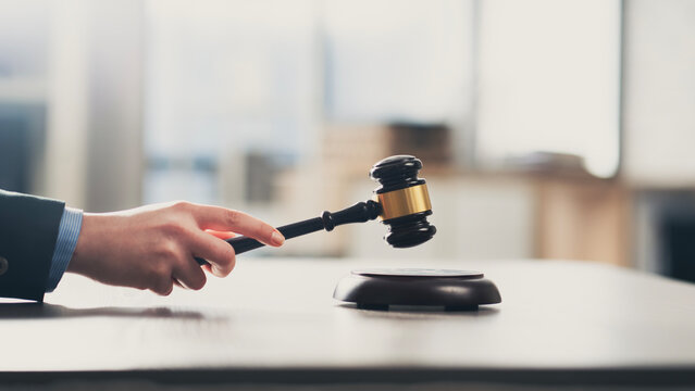 Hitting a gavel for finalizing the decision