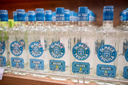 Moscow, Russia - January 25, 2026: Olmeca Tequila Silver bottles displayed on shelf in liquor store, blue caps and labels visible