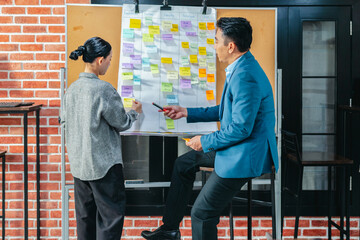 Professional Colleagues Brainstorming Ideas in a Modern Collaborative Workspace